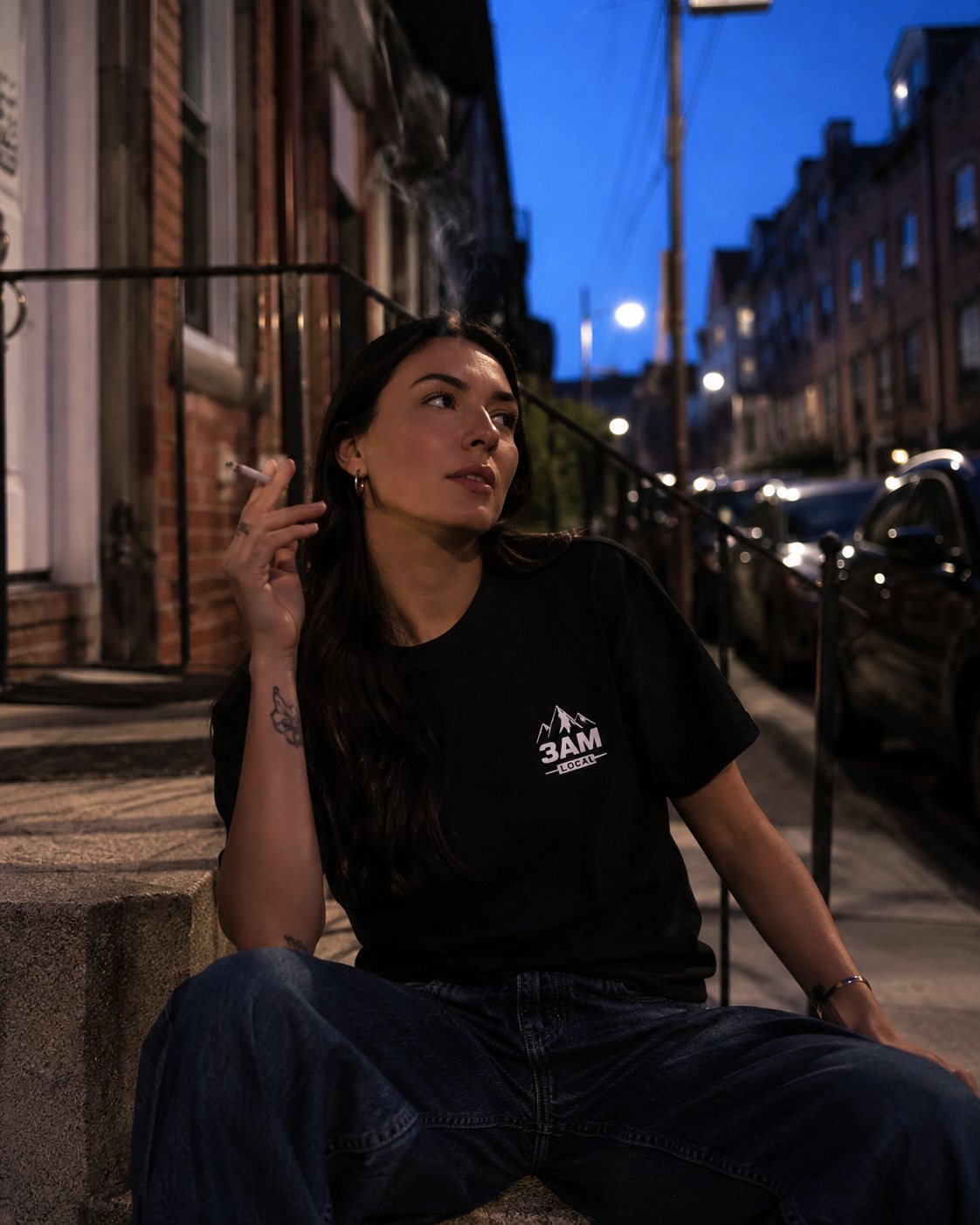 Double Black Diamond tee worn on a city stoop at blue hour