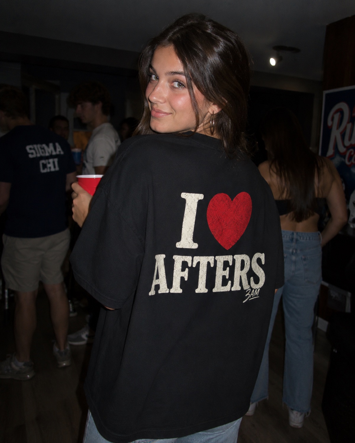 Real customer in the I heart Afters tee at a party